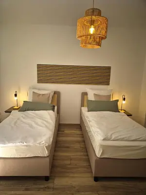 Ein Bett oder Betten in einem Zimmer der Unterkunft Ferienwohnung Bobingen