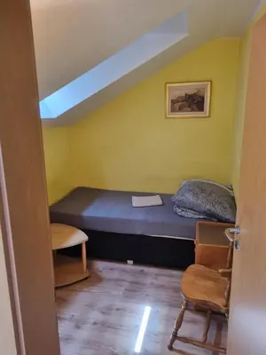 Ein Bett oder Betten in einem Zimmer der Unterkunft Pension Inntalhof