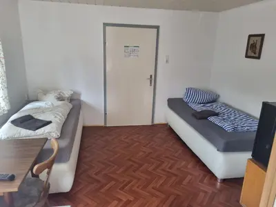 Ein Bett oder Betten in einem Zimmer der Unterkunft Pension Inntalhof