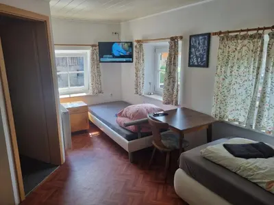 Ein Bett oder Betten in einem Zimmer der Unterkunft Pension Inntalhof