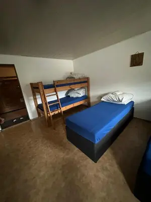 Ein Bett oder Betten in einem Zimmer der Unterkunft Pension Inntalhof