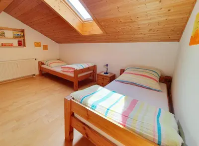 Ein Bett oder Betten in einem Zimmer der Unterkunft Ferienwohnungen Eibl