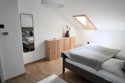 Ein Bett oder Betten in einem Zimmer der Unterkunft Ferienhaus Flying Roots Wackersberg