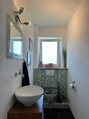 Ein Badezimmer in der Unterkunft Ferienwohnung Casa de Mane&Tina mit Gartenmitbenutzung