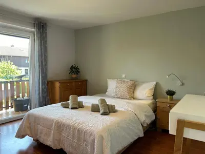 Ein Bett oder Betten in einem Zimmer der Unterkunft Ferienwohnung Casa de Mane&Tina mit Gartenmitbenutzung