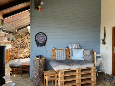Ein Sitzbereich in der Unterkunft Ferienwohnung Casa de Mane&Tina mit Gartenmitbenutzung