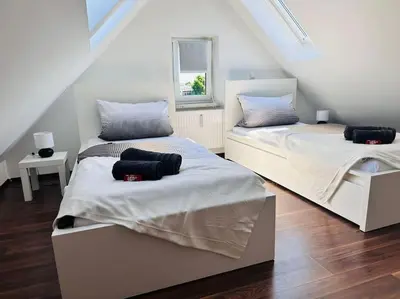 Ein Bett oder Betten in einem Zimmer der Unterkunft FeWo für 6 Personen WLAN Balkon Parken Stilvoll