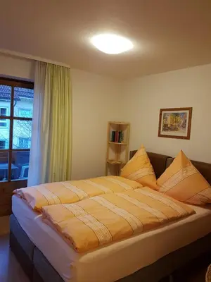 Ein Bett oder Betten in einem Zimmer der Unterkunft Agentur Bergblick