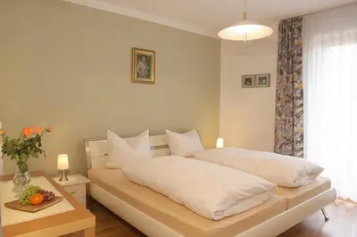 Ein Bett oder Betten in einem Zimmer der Unterkunft Ferienwohnung Genzinger
