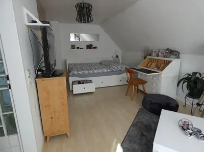 Ein Bett oder Betten in einem Zimmer der Unterkunft Nähe München - hell, zentral, ruhig, flughafennah