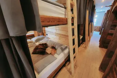 Ein Bett oder Betten in einem Zimmer der Unterkunft urig-alpine Lala Alm - 22 Personen