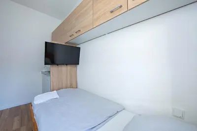 Ein Bett oder Betten in einem Zimmer der Unterkunft Schwanthaler Hof