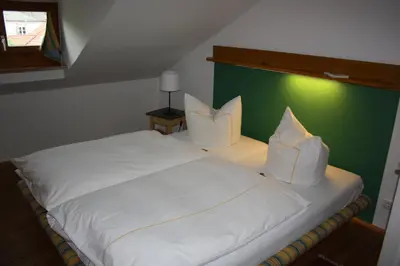 Ein Bett oder Betten in einem Zimmer der Unterkunft Elbrächter