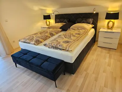 Ein Bett oder Betten in einem Zimmer der Unterkunft Ferienwohnungen Gottschlicht