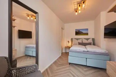 Ein Bett oder Betten in einem Zimmer der Unterkunft 3KORNHAUS - Das neue Alpendomizil