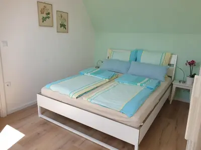 Ein Bett oder Betten in einem Zimmer der Unterkunft Ferienhaus in der Schwaighofstrasse