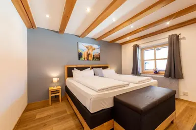 Ein Bett oder Betten in einem Zimmer der Unterkunft Alpenherz