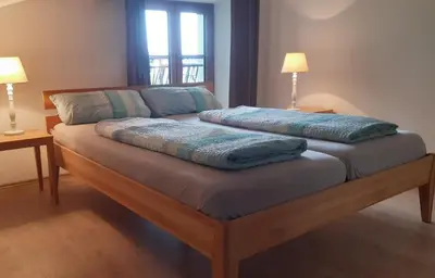 Ein Bett oder Betten in einem Zimmer der Unterkunft Lindlhof