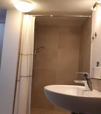 Ein Badezimmer in der Unterkunft Lindlhof
