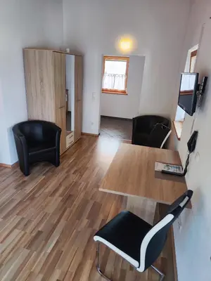 Ein Sitzbereich in der Unterkunft Gästehaus Hubertus
