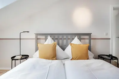 Ein Bett oder Betten in einem Zimmer der Unterkunft Cozy Apartment