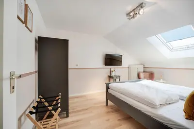 Ein Bett oder Betten in einem Zimmer der Unterkunft Cozy Apartment