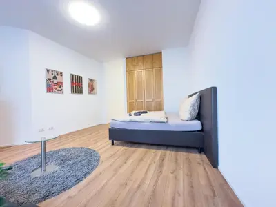 Ein Bett oder Betten in einem Zimmer der Unterkunft Moderne Wohnung im Zentrum der Altstadt - Altbau Flair, WLAN