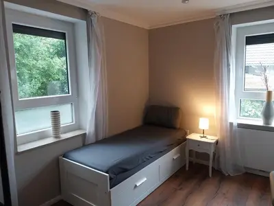 Ein Bett oder Betten in einem Zimmer der Unterkunft Bad Aibling City Apartment Zimmer