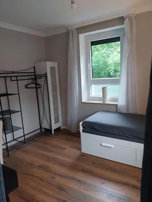 Ein Bett oder Betten in einem Zimmer der Unterkunft Bad Aibling City Apartment Zimmer
