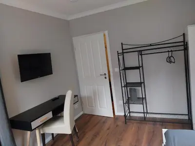 TV/Unterhaltungsangebot in der Unterkunft Bad Aibling City Apartment Zimmer