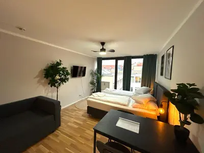Ein Bett oder Betten in einem Zimmer der Unterkunft Cozy apartment in city center
