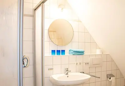 Ein Badezimmer in der Unterkunft Ferienwohnungen hinter der Residenz