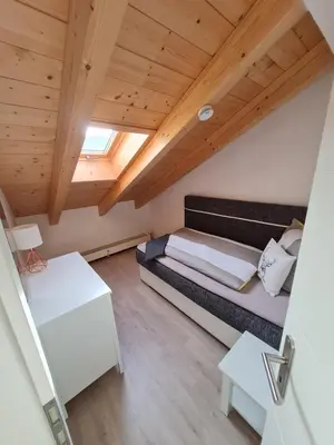 Ein Bett oder Betten in einem Zimmer der Unterkunft Bergkristall