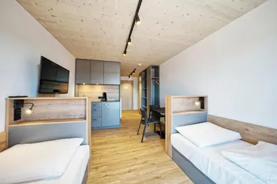 Ein Bett oder Betten in einem Zimmer der Unterkunft Timber One Boardinghouse Dorfen