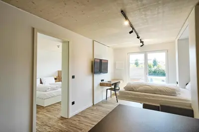 Ein Bett oder Betten in einem Zimmer der Unterkunft Timber One Boardinghouse Dorfen