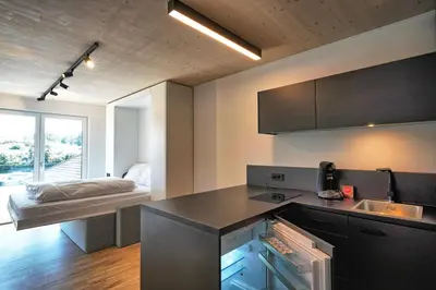 Küche/Küchenzeile in der Unterkunft Timber One Boardinghouse Dorfen