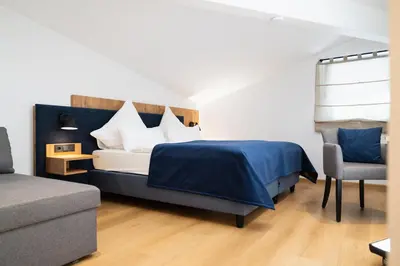 Ein Bett oder Betten in einem Zimmer der Unterkunft Hotel Restaurant Hafenwirt