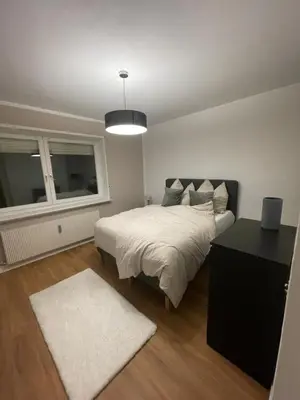 Ein Bett oder Betten in einem Zimmer der Unterkunft Quiet Family Apartment - 10 min to Center & Oktoberfest - Free Parking - near Nymphenburg Palace & Botanical garden