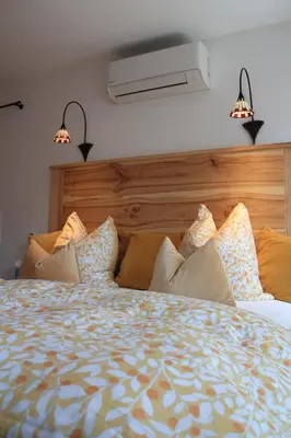 Ein Bett oder Betten in einem Zimmer der Unterkunft Ferienwohnung BERGWELTEN