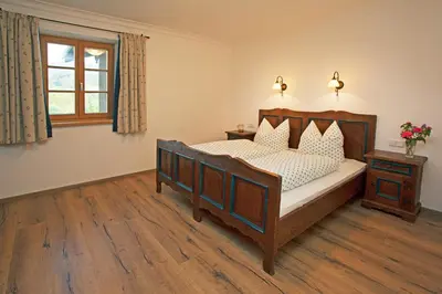 Ein Bett oder Betten in einem Zimmer der Unterkunft Thaurerhof Urlaub auf dem Bauernhof