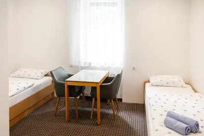 Ein Bett oder Betten in einem Zimmer der Unterkunft Pension Märkl Augsburg