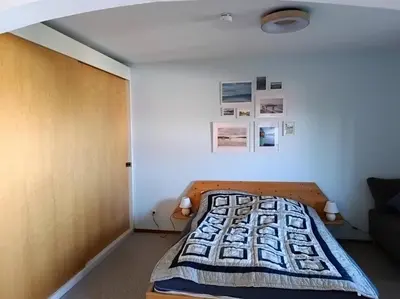 Ein Bett oder Betten in einem Zimmer der Unterkunft Ferienwohnung EG mit Bergblick