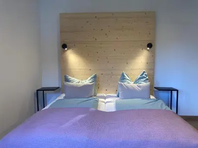 Ein Bett oder Betten in einem Zimmer der Unterkunft Bett & Berge - Ferienapartment in den Schlierseer Bergen
