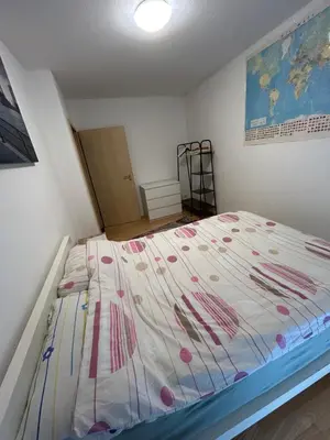 Ein Bett oder Betten in einem Zimmer der Unterkunft Moderne Unterkunft - nah am Flughafen MUC und TU München