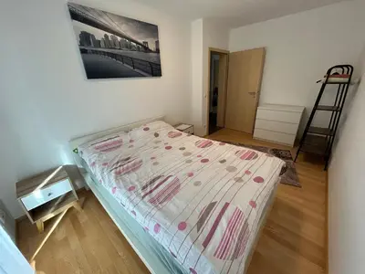 Ein Bett oder Betten in einem Zimmer der Unterkunft Moderne Unterkunft - nah am Flughafen MUC und TU München