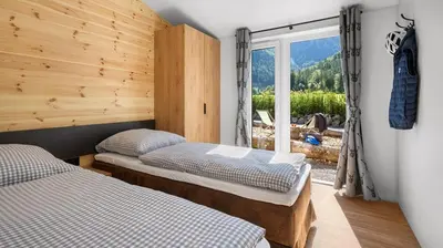 Ein Bett oder Betten in einem Zimmer der Unterkunft NATURAMA Glockenalm