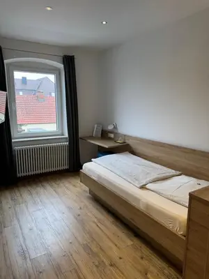 Ein Bett oder Betten in einem Zimmer der Unterkunft Gasthaus - Hotel Neue Post
