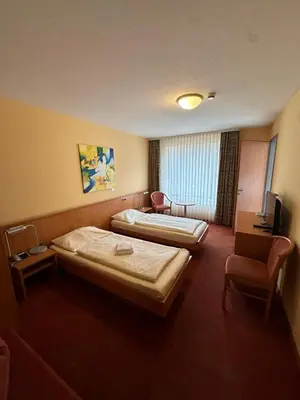 Ein Bett oder Betten in einem Zimmer der Unterkunft Gasthaus - Hotel Neue Post