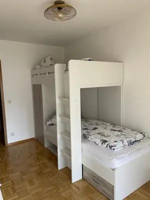 Ein Bett oder Betten in einem Zimmer der Unterkunft Ferienhaus Partenkirchen