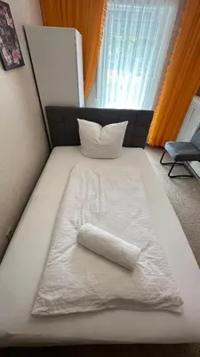 Ein Bett oder Betten in einem Zimmer der Unterkunft Tabita 1 Apartment with 3 rooms if needed 4 or 5 rooms
